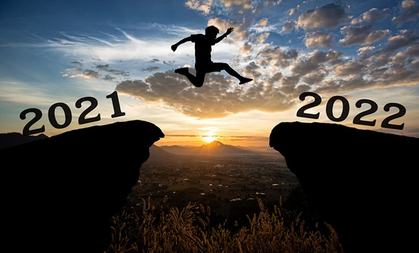 Image of man jumping from over rock from 2021 to 2022